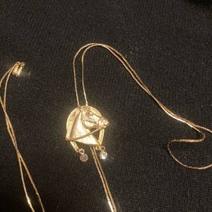 Gold plated horse necklace in bolo style.